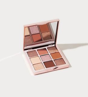 monat veganlyy opened essential glam palette with 9 sectionsby 1g eyeshadows on white surface