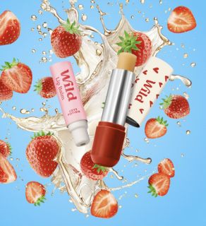 photo of pack - strawberry refill and red hearts case of wild cosmetics on animated backgrownd of cutted strawberries and splash presented by veganlyy beauty section