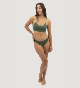a woman wearing 1-people-l-veganlyy-canggu-econyl-bieconyl bikini green set seaweed presented by veganlyy