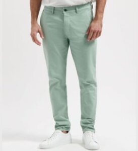 man wearing organic cotton green chino dexter vegan pants presented by veganlyy.com