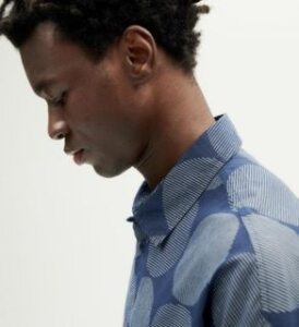 black young man wearing blue haru shirt on light background presented by veganlyy.com