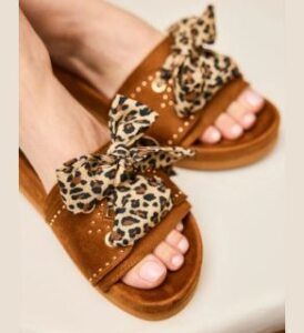 women's feet wearing dune vegan suede slide sandals for women of minuit sur terre presented by veganlyy www.veganlyy.com