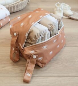 Cloth Nappy Pod from Modern Cloth Nappies color Sunnie Camels with White unzipped with 3 nappies inside presented by veganlyy