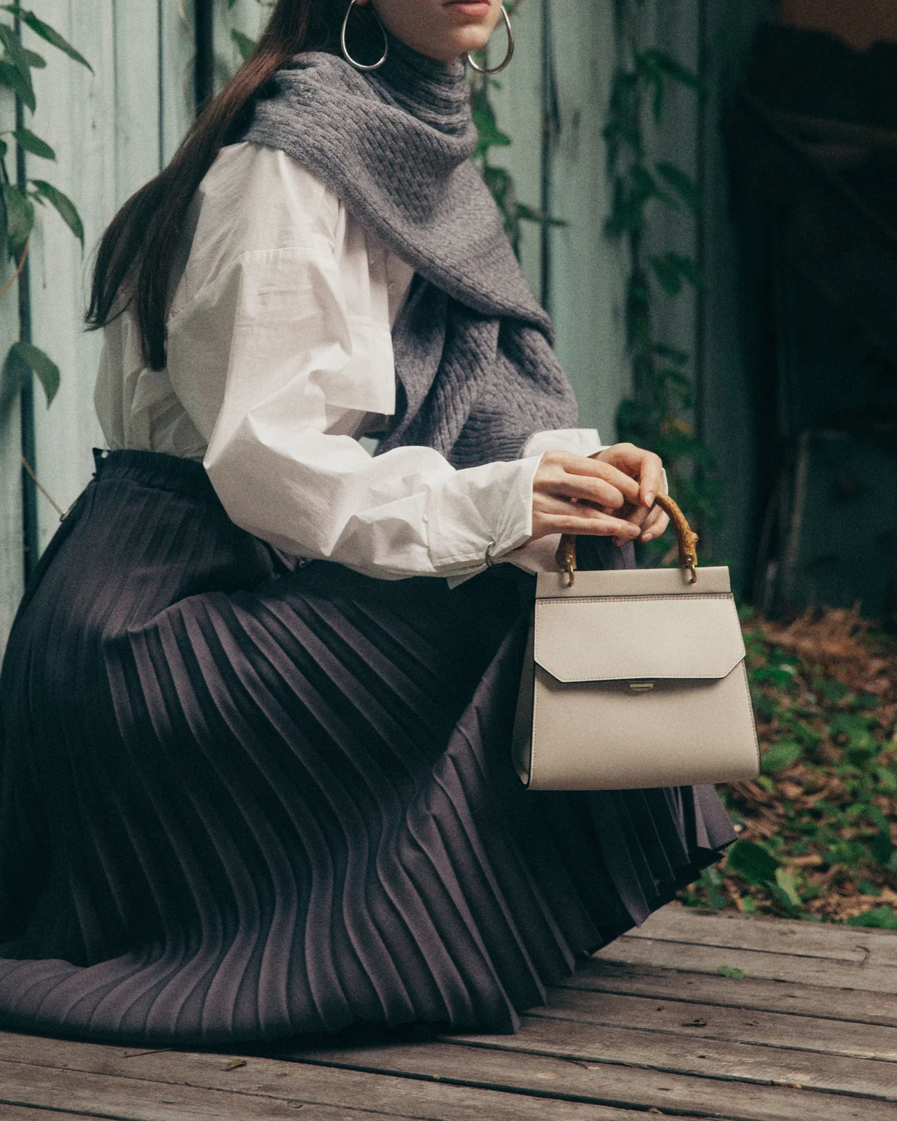 veganlyy blog plastic free wardrobe cruelty free ethical fashion a woman holding a mini bo corn leather handbag by O.N.E. Concepts