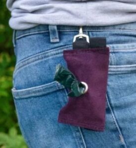 veganlyy vegan velvet dog poo bag holder pendant on a belt of a person with bags showing on