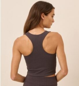 chocolate colour on the go-on crop tank from pact apparel worn by young woman backside watching on the right presented by veganlyy